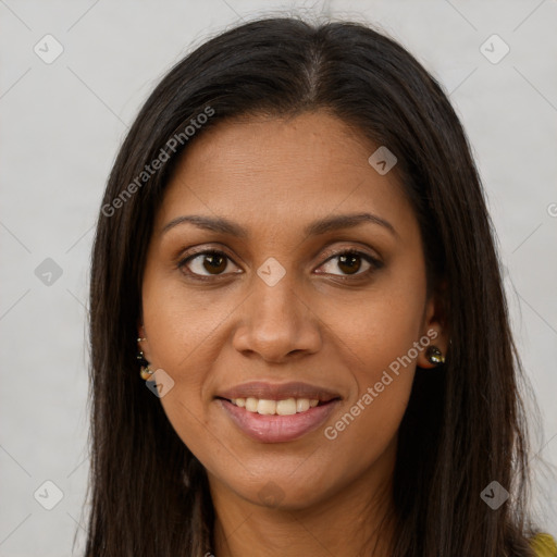 Joyful black young-adult female with long  brown hair and brown eyes