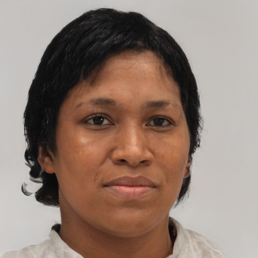 Joyful black young-adult female with medium  brown hair and brown eyes
