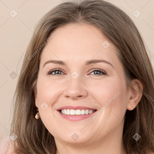 Joyful white young-adult female with long  brown hair and grey eyes