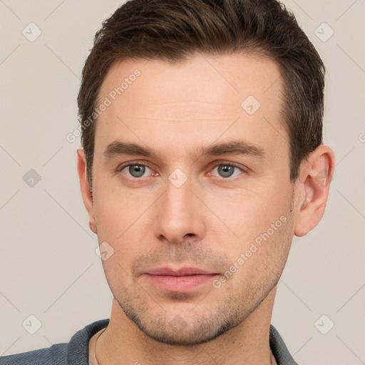 Neutral white young-adult male with short  brown hair and brown eyes