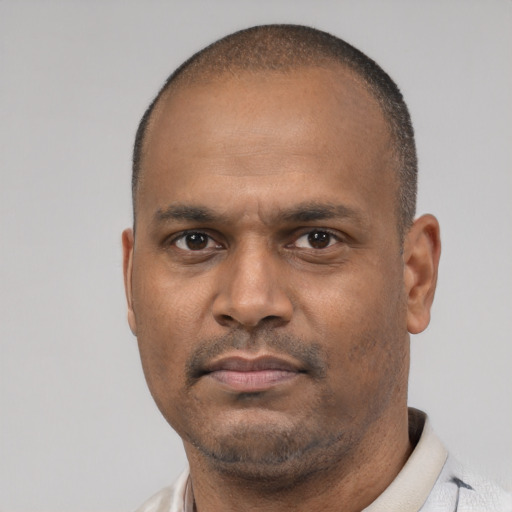 Neutral latino adult male with short  black hair and brown eyes
