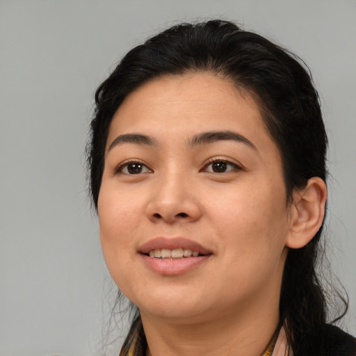 Joyful asian young-adult female with medium  brown hair and brown eyes