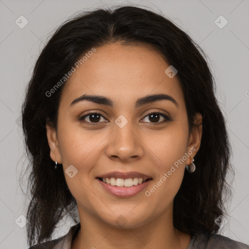 Joyful latino young-adult female with long  brown hair and brown eyes