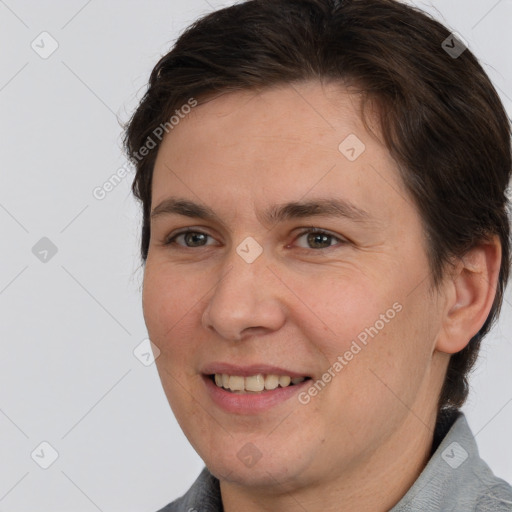 Joyful white adult female with short  brown hair and brown eyes