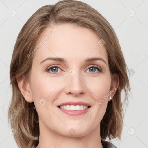 Joyful white young-adult female with medium  brown hair and blue eyes