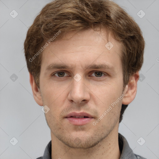 Joyful white adult male with short  brown hair and grey eyes