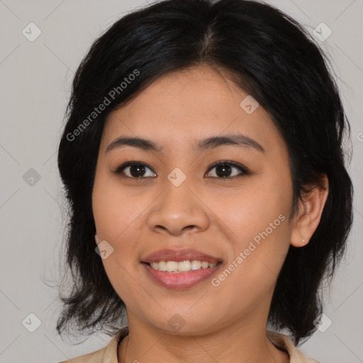 Joyful asian young-adult female with medium  brown hair and brown eyes