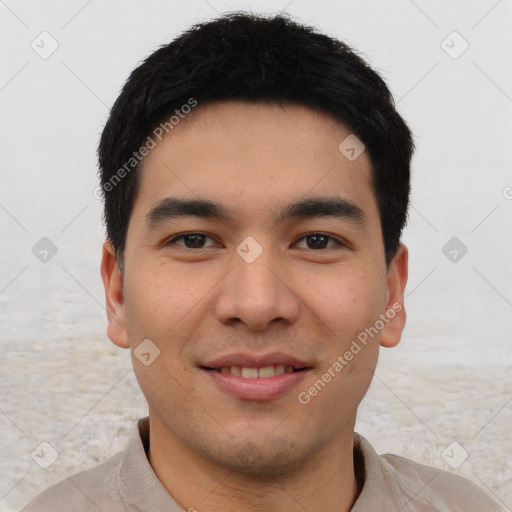 Joyful asian young-adult male with short  black hair and brown eyes