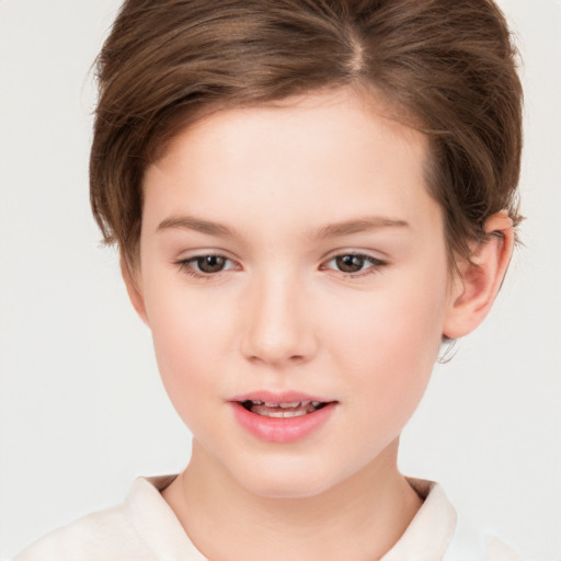 Joyful white child female with short  brown hair and brown eyes