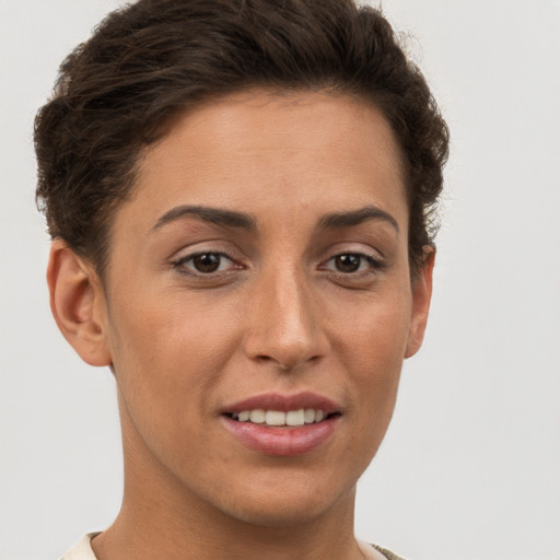 Joyful white young-adult female with short  brown hair and brown eyes