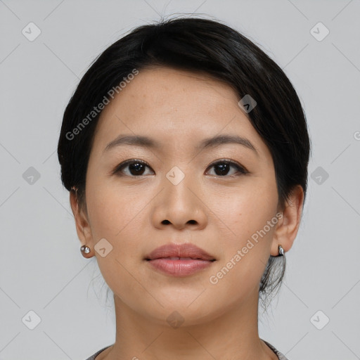 Joyful asian young-adult female with short  black hair and brown eyes