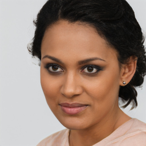 Joyful latino young-adult female with medium  black hair and brown eyes