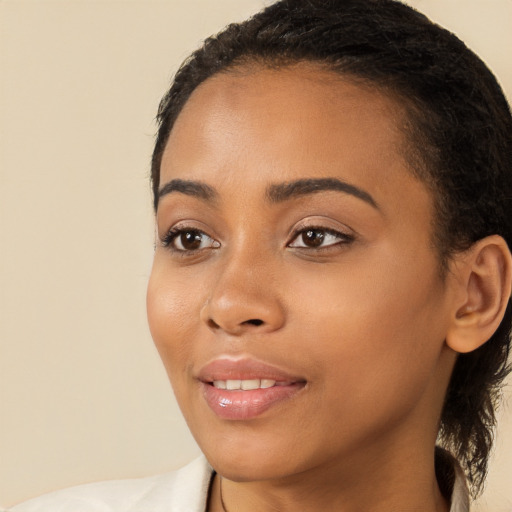 Joyful latino young-adult female with medium  brown hair and brown eyes