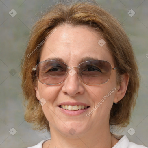 Joyful white adult female with medium  brown hair and blue eyes