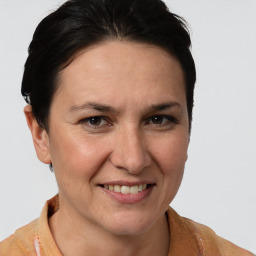 Joyful white adult female with short  brown hair and brown eyes