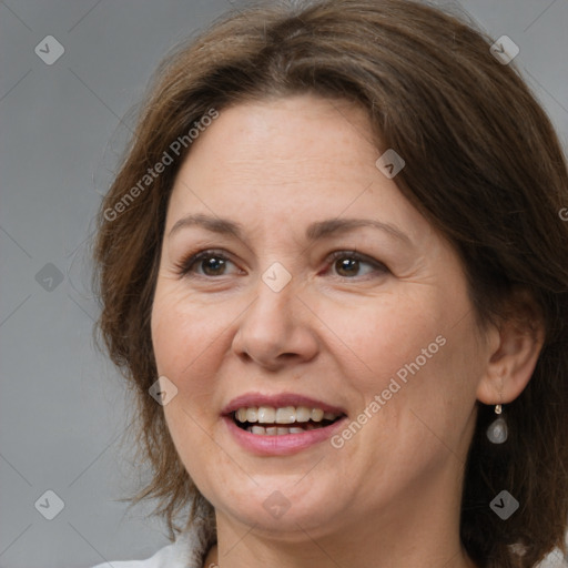 Joyful white adult female with medium  brown hair and grey eyes