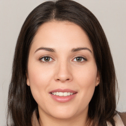 Joyful white young-adult female with medium  brown hair and brown eyes