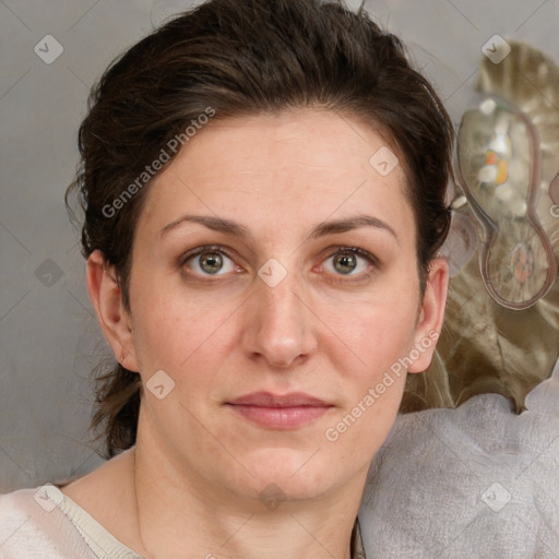 Joyful white adult female with medium  brown hair and green eyes