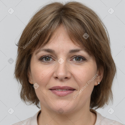 Joyful white adult female with medium  brown hair and grey eyes