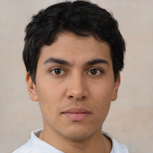 Neutral latino young-adult male with short  brown hair and brown eyes