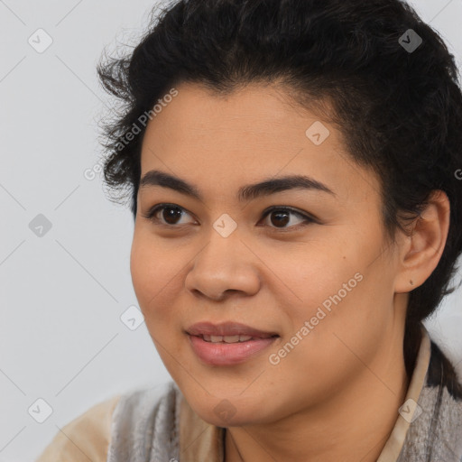 Joyful latino young-adult female with short  black hair and brown eyes