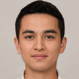 Joyful latino young-adult male with short  brown hair and brown eyes