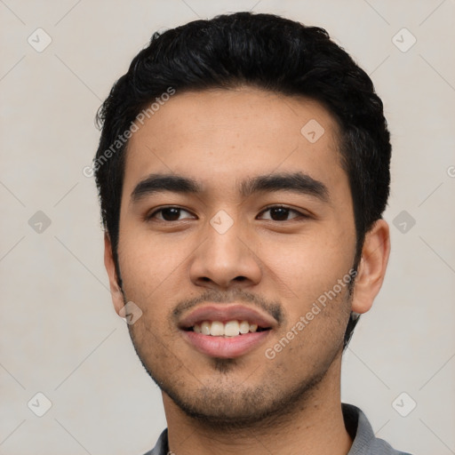 Joyful asian young-adult male with short  black hair and brown eyes