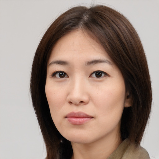 Neutral white young-adult female with medium  brown hair and brown eyes