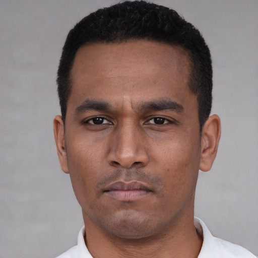 Neutral latino young-adult male with short  black hair and brown eyes