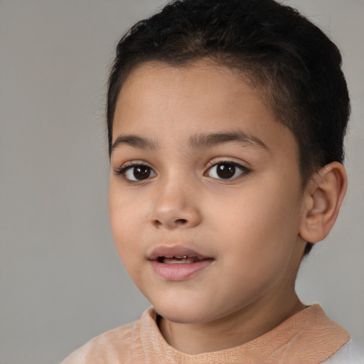 Joyful white child female with short  brown hair and brown eyes