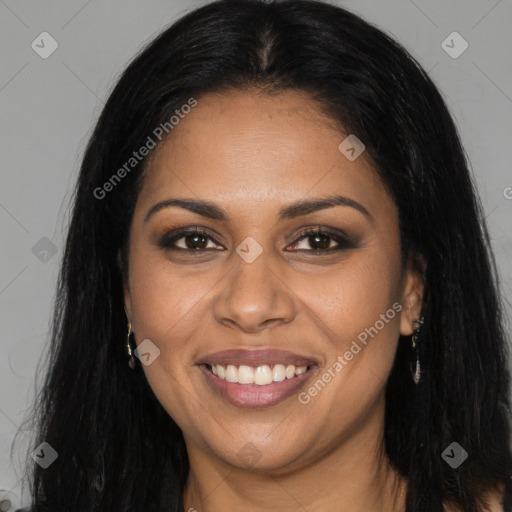 Joyful black young-adult female with long  brown hair and brown eyes