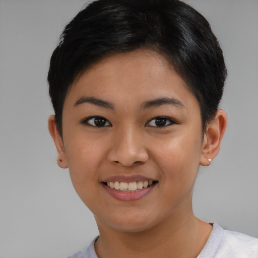 Joyful asian young-adult female with short  brown hair and brown eyes