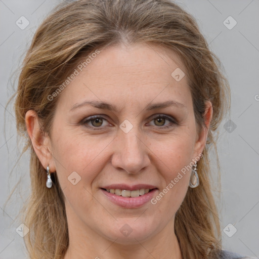 Joyful white adult female with medium  brown hair and grey eyes