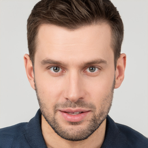 Joyful white young-adult male with short  brown hair and brown eyes