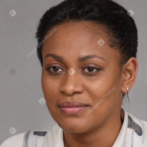 Joyful black young-adult female with short  black hair and brown eyes