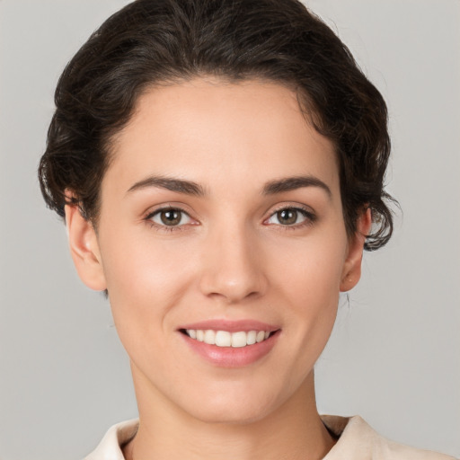 Joyful white young-adult female with short  brown hair and brown eyes