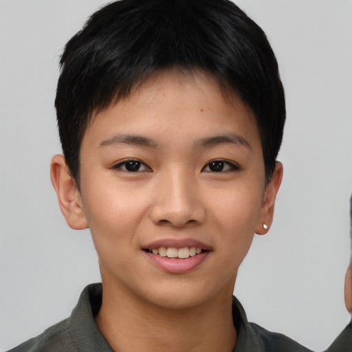 Joyful asian young-adult female with short  black hair and brown eyes