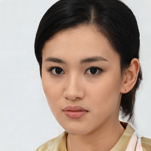 Neutral asian young-adult female with medium  brown hair and brown eyes