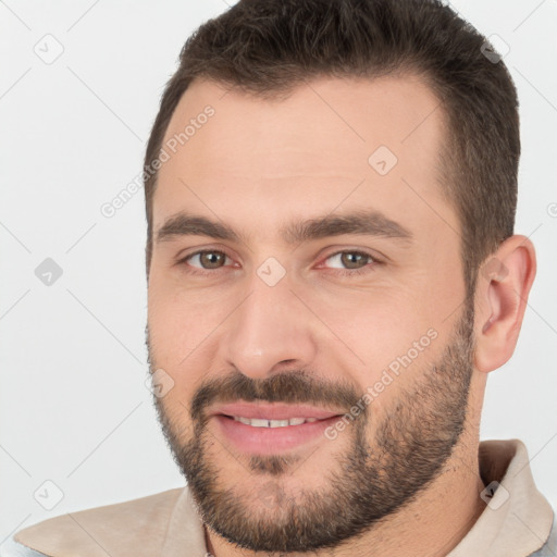 Joyful white young-adult male with short  brown hair and brown eyes