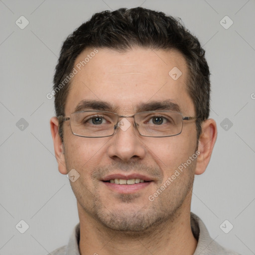 Joyful white adult male with short  brown hair and brown eyes