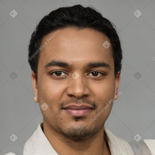 Joyful latino young-adult male with short  black hair and brown eyes