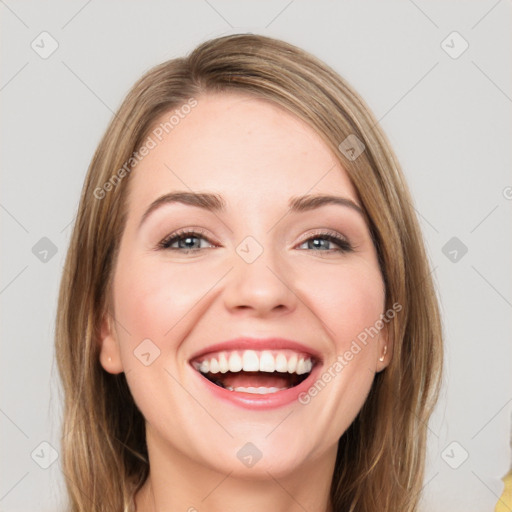 Joyful white young-adult female with long  brown hair and blue eyes