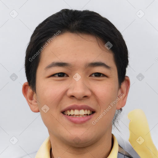 Joyful asian young-adult male with short  brown hair and brown eyes