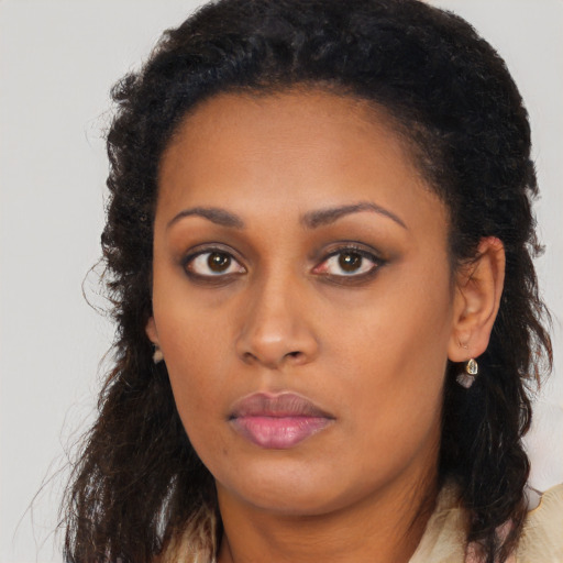 Neutral black young-adult female with long  brown hair and brown eyes