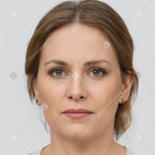 Joyful white adult female with medium  brown hair and grey eyes