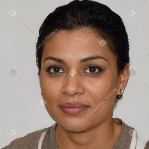 Joyful latino young-adult female with short  black hair and brown eyes