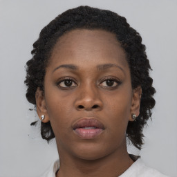 Neutral black young-adult female with short  brown hair and brown eyes