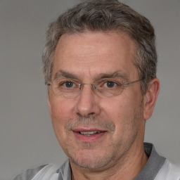 Joyful white middle-aged male with short  brown hair and brown eyes