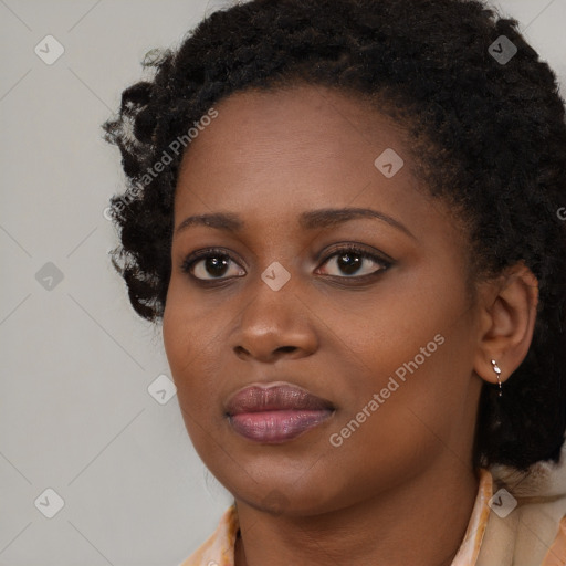 Neutral black young-adult female with long  brown hair and brown eyes