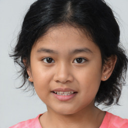 Joyful white child female with medium  brown hair and brown eyes